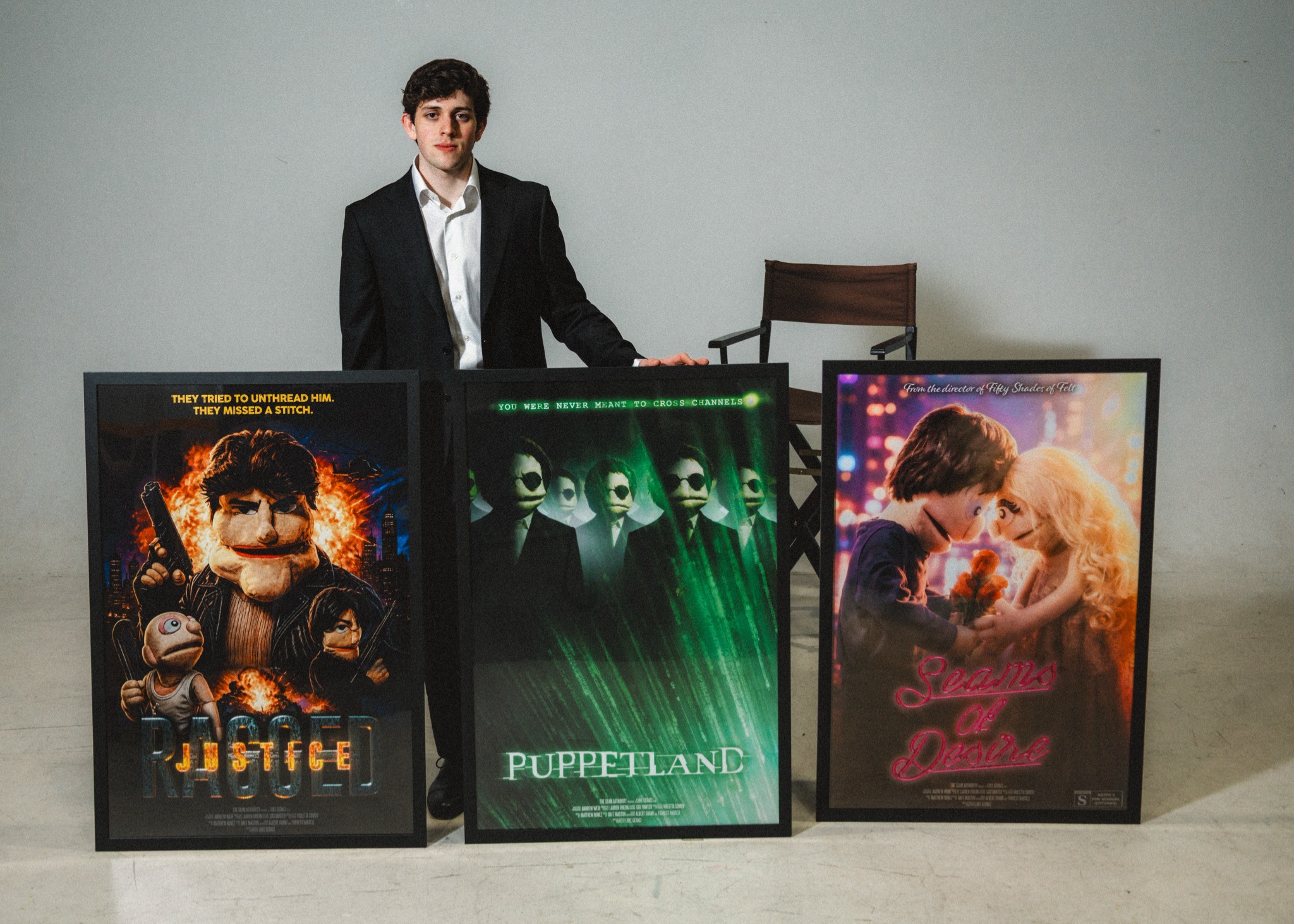 Luke Geraci with Puppetland posters